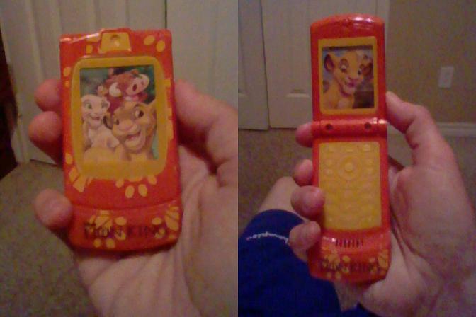 Simba talking flip phone.JPG